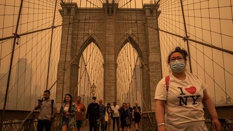 Smoke from Canadian wildfires turned the New York City sky dark yellow in June.