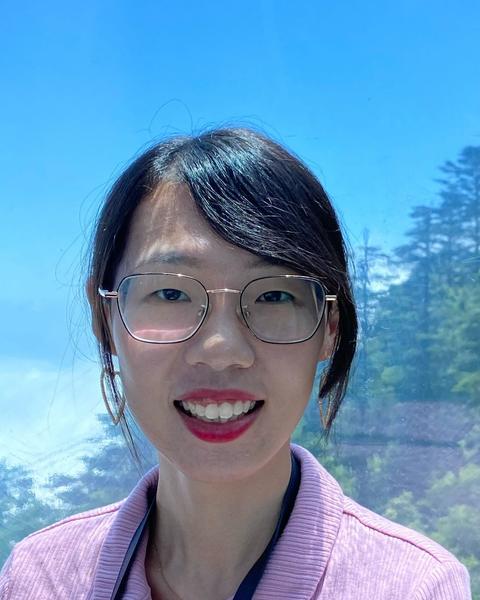 A person smiling wearing glasses