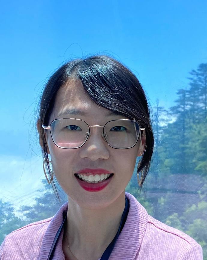 A person smiling wearing glasses